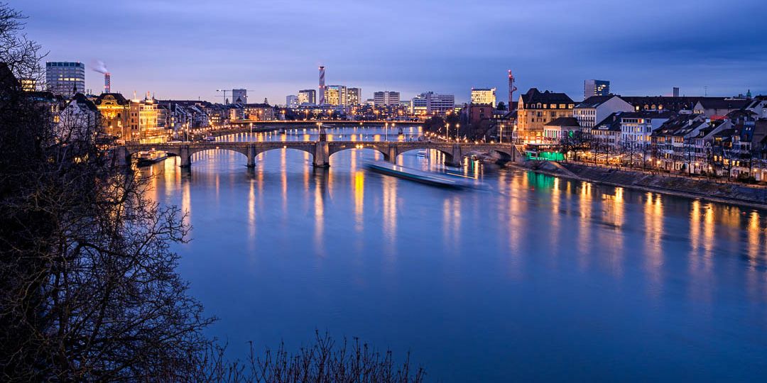 Foto from the Pfalz at the Minster in Basel looking down the Rhine during blue hour